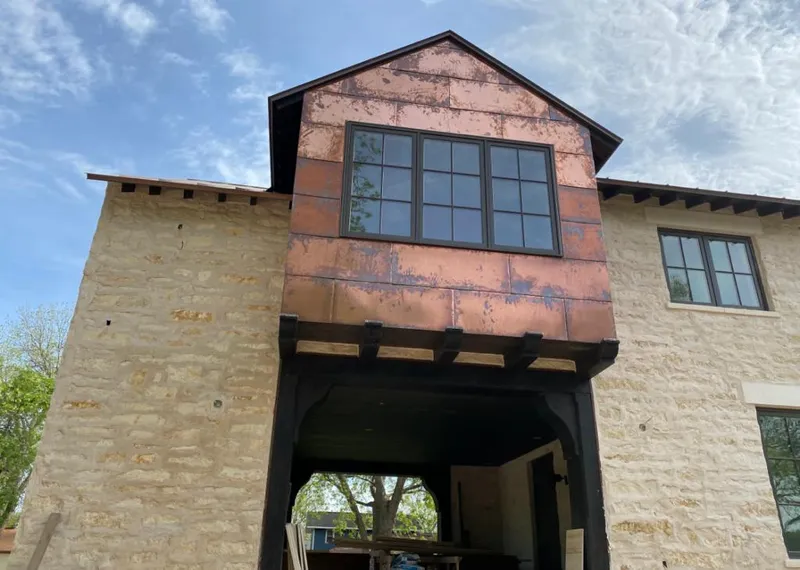 Copper metal panel facade on a stone building for Skylight Installation in Lake San Marcos