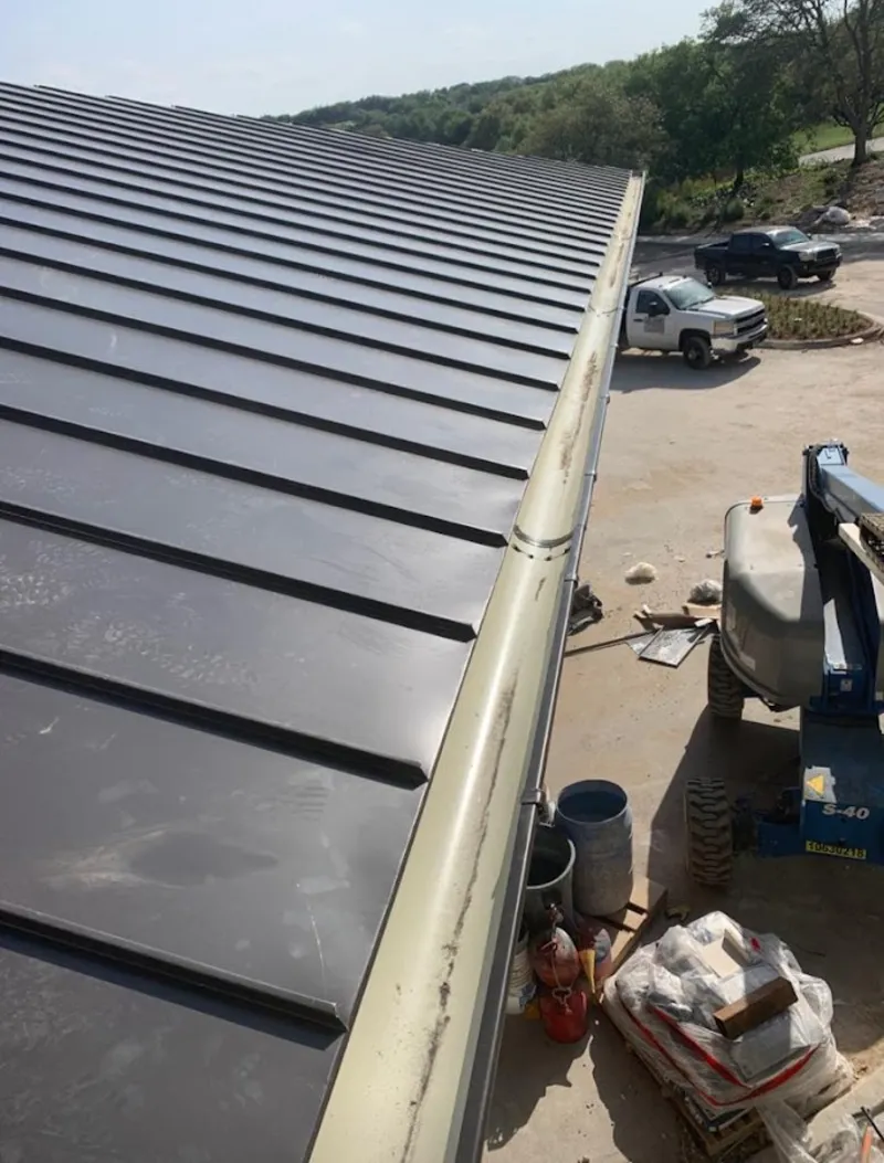 Standing seam panel and gutter detail on a metal roofing jobsite in Lake San Marcos